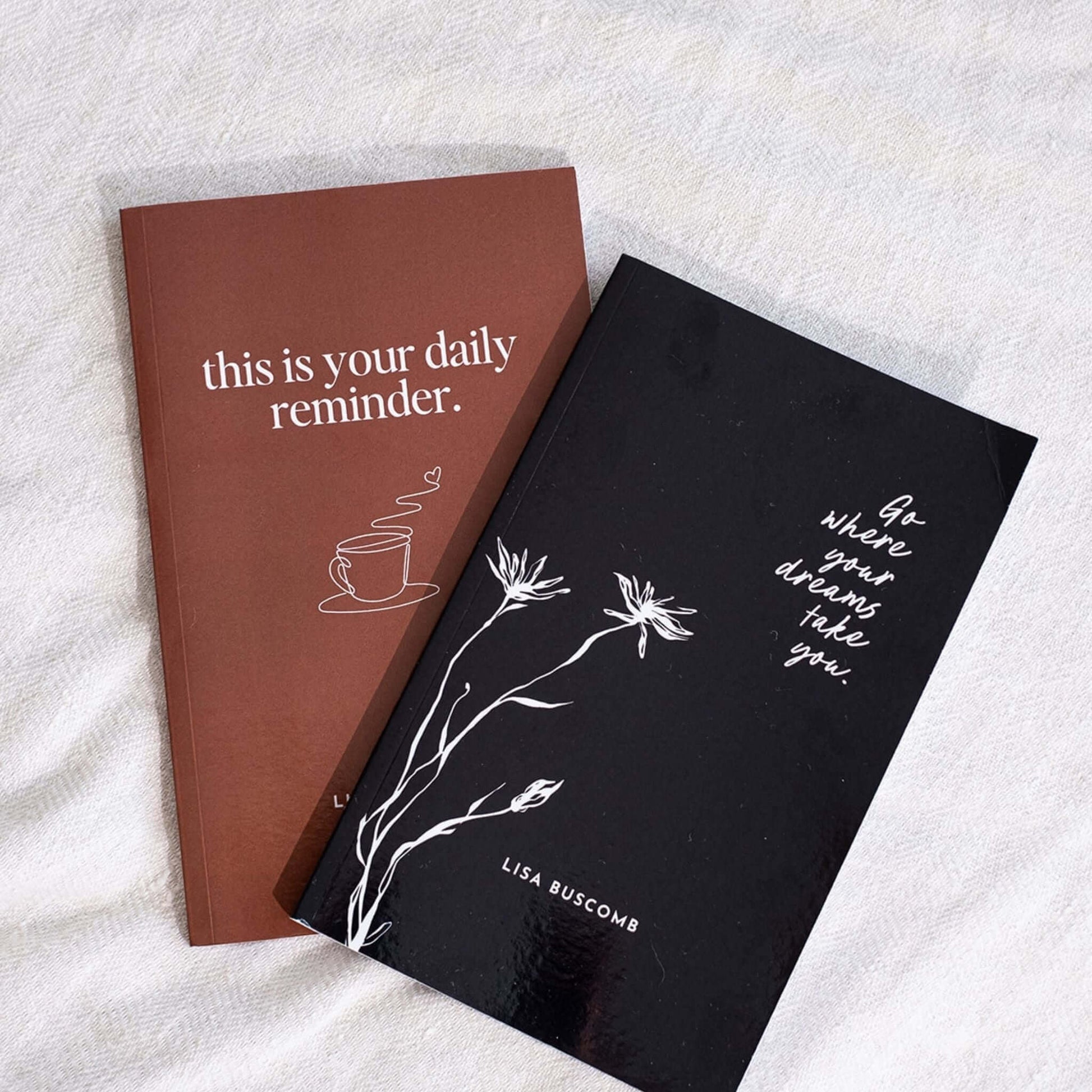 Gentle Daily Reminders Book by Lisa Buscomb shown with another inspirational book on a cozy surface.