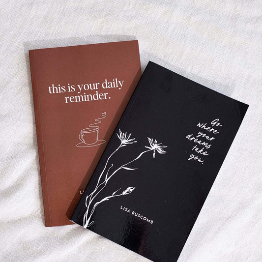 Gentle Daily Reminders Book by Lisa Buscomb shown with another inspirational book on a cozy surface.
